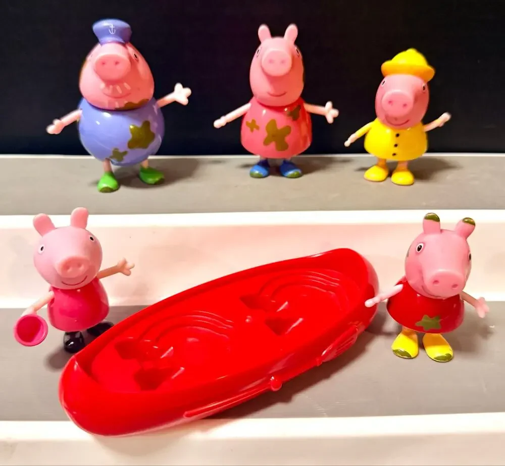 Peppa Pig Muddy Puddles figures and red canoe